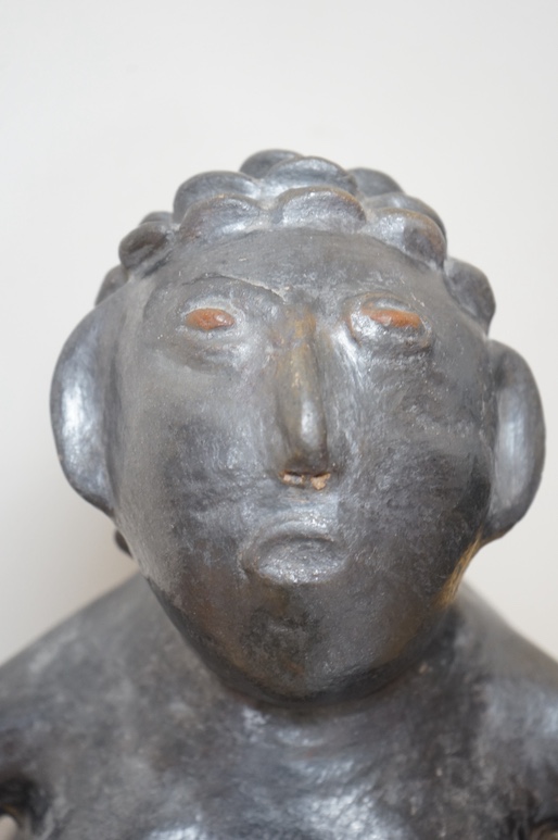 An African clay sculpture of a woman by Jesserina Chamisa, 52cm high. Condition - good